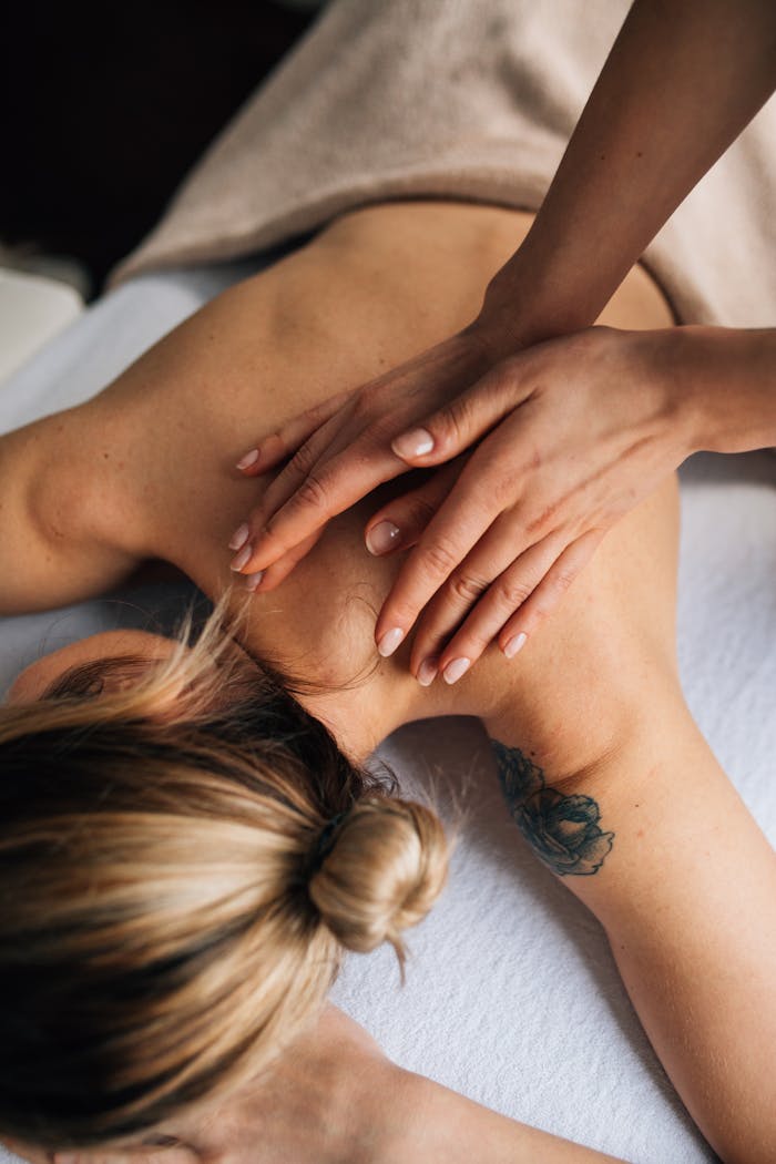 our-facilities-03 Female receiving a soothing massage in a tranquil spa environment, focusing on wellbeing.